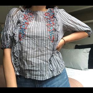 Fun striped blouse with floral details!